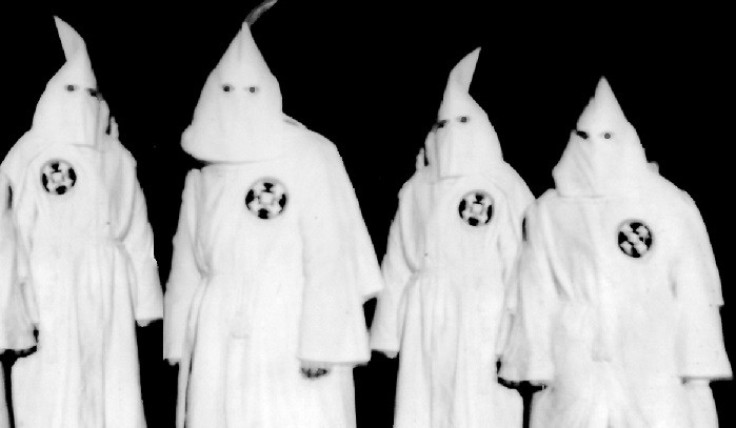 Ku Klux Klan members in full hooded regalia