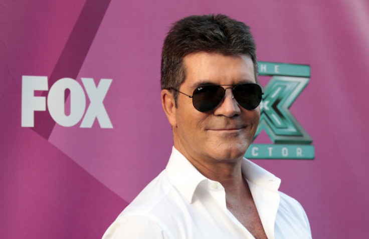 Simon Cowell Spotted With Lauren Silverman For the First Time in Public After Divorce/Reuters