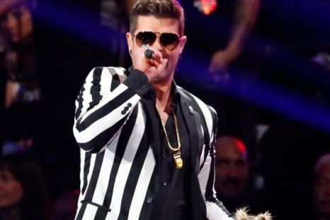 Miley Cyrus and Robin Thicke perform "Blurred Lines" during the 2013 MTV Video Music Awards in New York August 25, 2013.