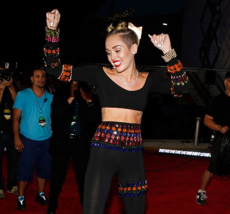 Singer Miley Cyrus arrives at the 2013 MTV Video Music Awards in New York August 25, 2013.