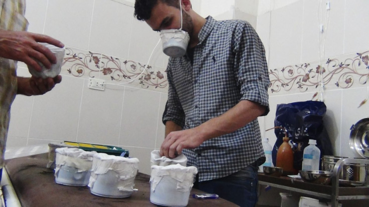 Activists and medics manufacture homemade chemical masks in Damascus' suburbs of Zamalka