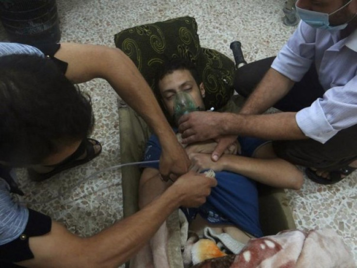 An emergency response team attends to a chemical attack victim in Syria