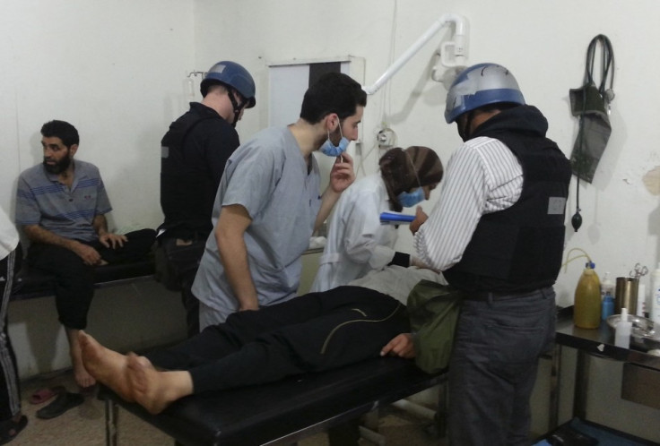 U.N. chemical weapons experts visit people affected by an apparent gas attack, at a hospital in the southwestern Damascus suburb of Mouadamiya