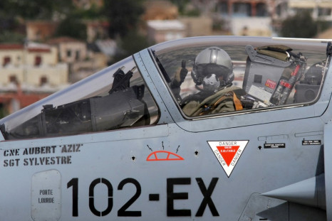 A French pilot gives a thumbs-up before taking off in a French Mirage 2000 fighter jet from the Greek air base at Souda
