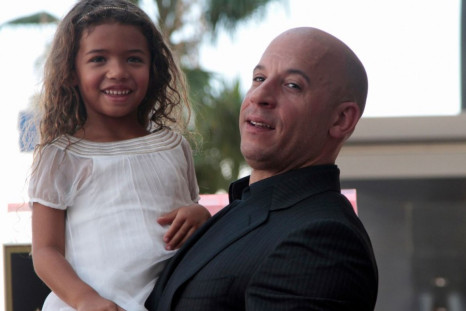 Actor Vin Diesel poses with his daughter Hania Riley during a ceremony to unveil his star on the Hollywood Walk of Fame in Hollywood, California, August 26, 2013.