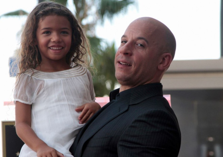 Actor Vin Diesel poses with his daughter Hania Riley during a ceremony to unveil his star on the Hollywood Walk of Fame in Hollywood, California, August 26, 2013.