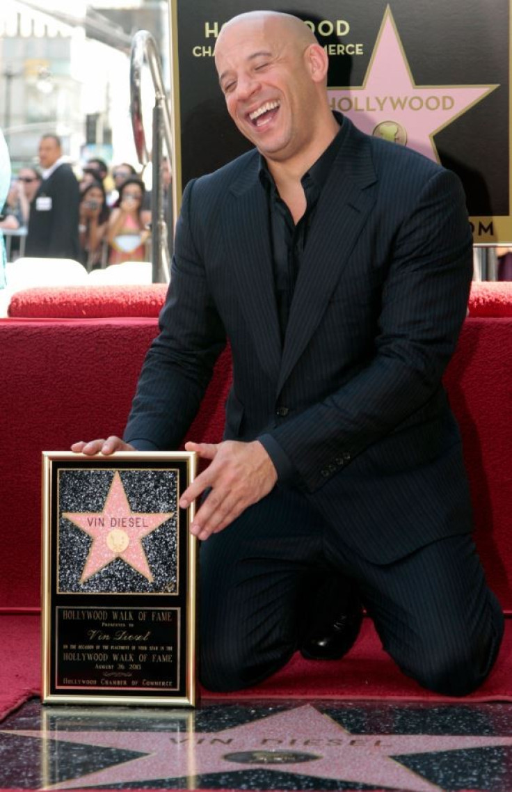Actor Vin Diesel poses with his newly unveiled star on the Hollywood Walk of Fame in Hollywood, California, August 26, 2013.