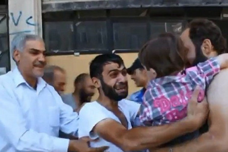 Father and son reunited after poison gas attack in Damascus PIC: YouTube
