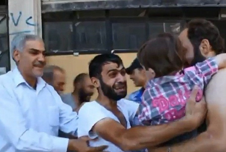 Father and son reunited after poison gas attack in Damascus PIC: YouTube