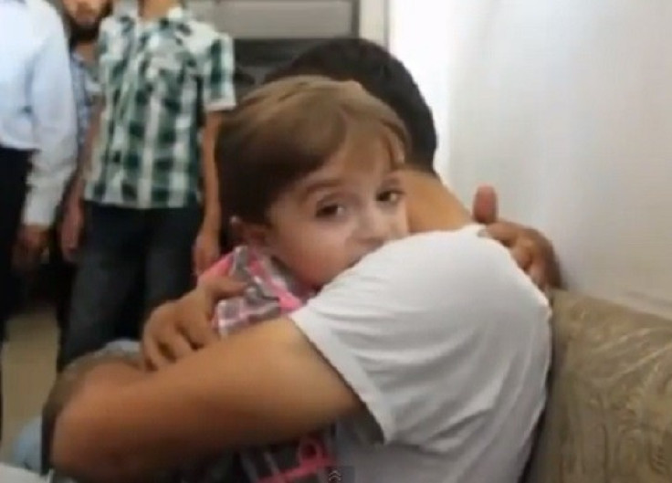 Father and son reunited after Damascus poison gas attack PIC: YouTube