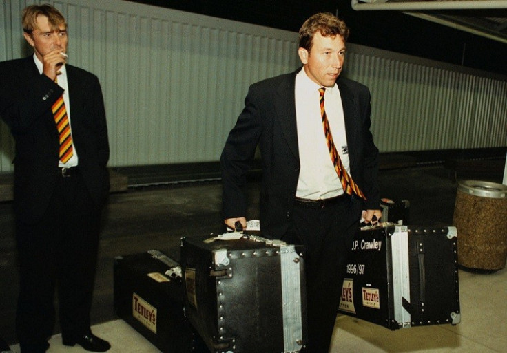 Phil Tufnell (l) in relaxed mood, as skipper Michael Atherton takes the bags during England's troubled tour of New Zealand