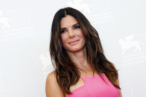 Sandra Bullock, 49, didn't opt for any accessories but  nude heels. (REUTERS/Alessandro Bianchi)