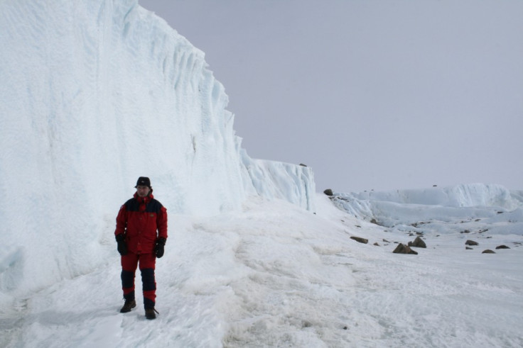 Norway's Prime Minister Jens Stoltenberg studies glacier