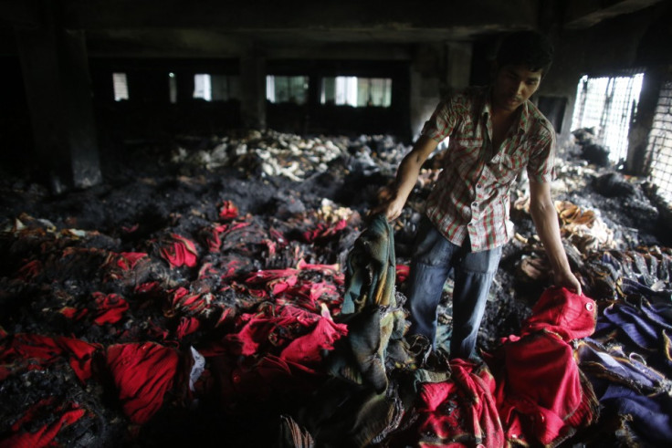Sweat shop workers risk burning to death in factory fires like this one in Dkara PIC: Reuters