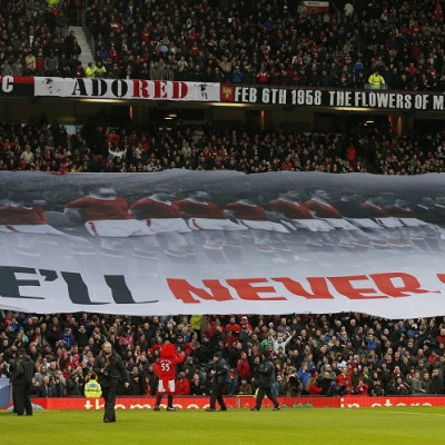 A banner is unfurled at Old Trafford to commemorate the 55th anniversary of the Munich air crash (Reuters)