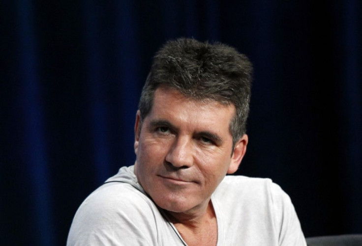 Simon Cowell's Wedding Plans Underway/Reuters