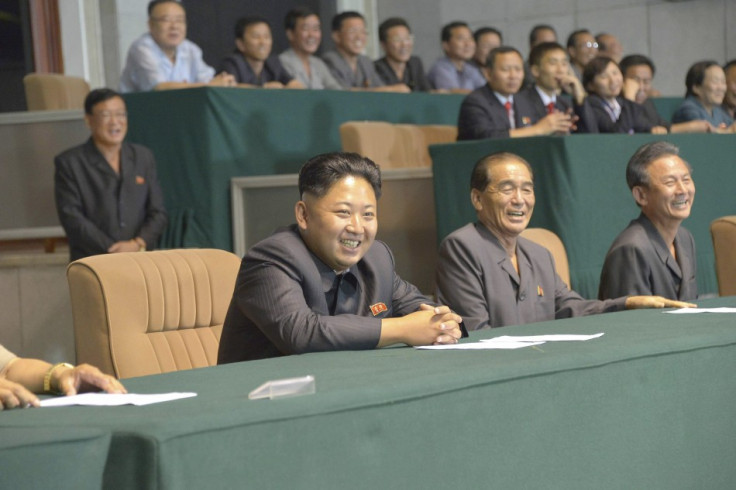 Kim Jong-un (c) watches a football match with senior generals, with former chief Kim Kyok-sik conspicuous by his absence.