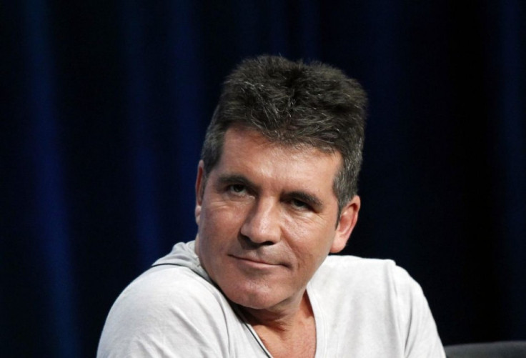 Simon Cowell Already On a Shopping Spree For His Baby/Reuters