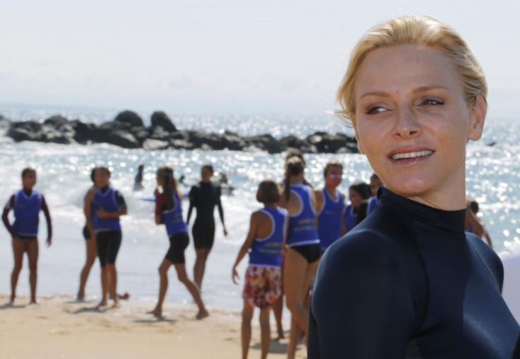 Princess Charlene of Monaco walks on the beach during a swimming event for her foundation in Capbreton, Southwestern France, September 1, 2013. (REUTERS/Regis Duvignau)