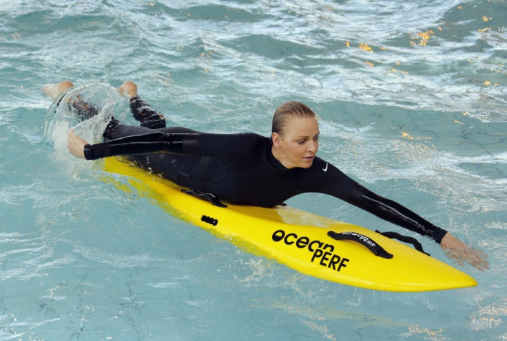 Princess Charlene of Monaco paddles during the swimming event for her foundation. (REUTERS/Regis Duvignau)