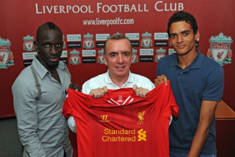 Liverpool defenders Sakho (left) and Ilori (right) with managing director Ian Ayre (centre). (Photo: Liverpool FC)