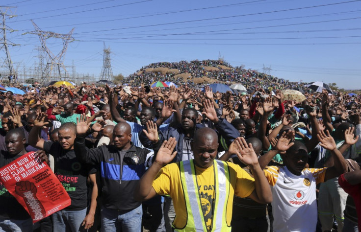 Miners congregate at the Marikana mines one year on from shooting