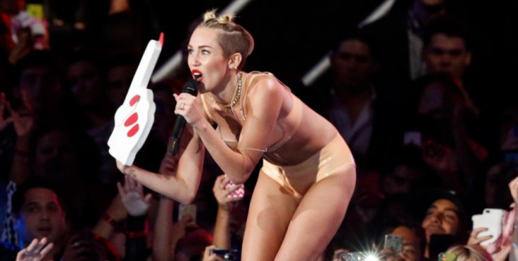 Miley Cyrus Reaches New Level In Paparazzi Bashing, Calls Him a "C**T" and Tweets About it