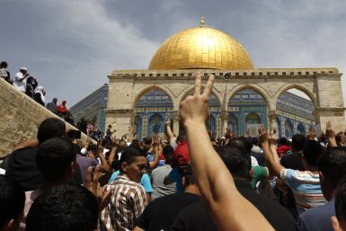 Palestinians take part in a protest after Friday prayers
