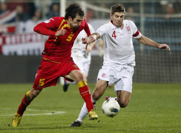 Vladimir Volkov (L) and Steven Gerrard