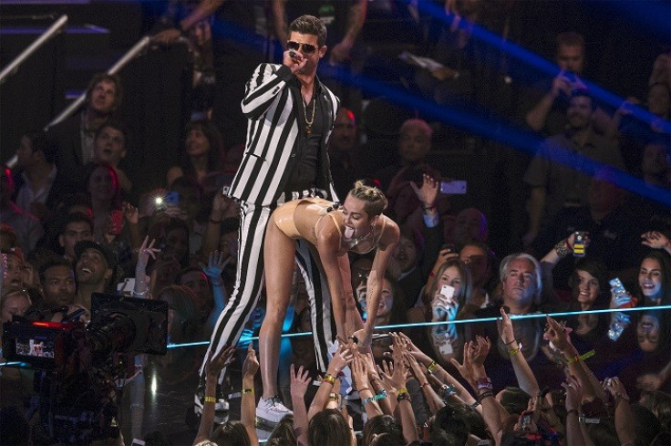 Miley Cyrus twerking with Robin Thicke.