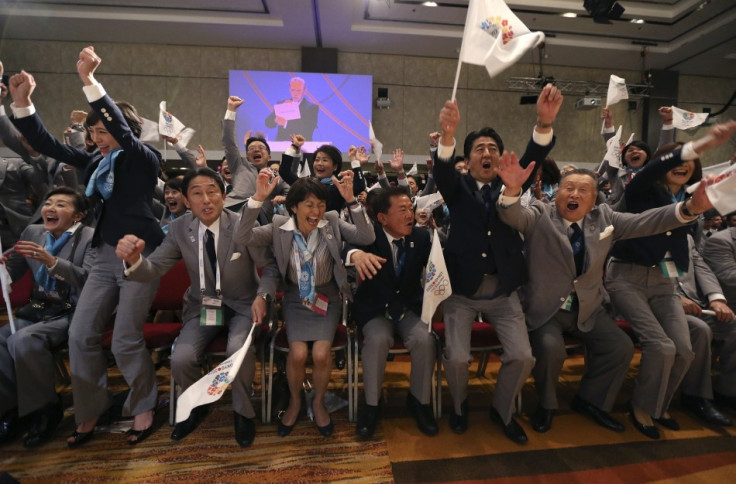 Japanese prime minister Shinzo Abe (2nd right0 celebrates Tokyo being awarded the 2020 Olympic Games.