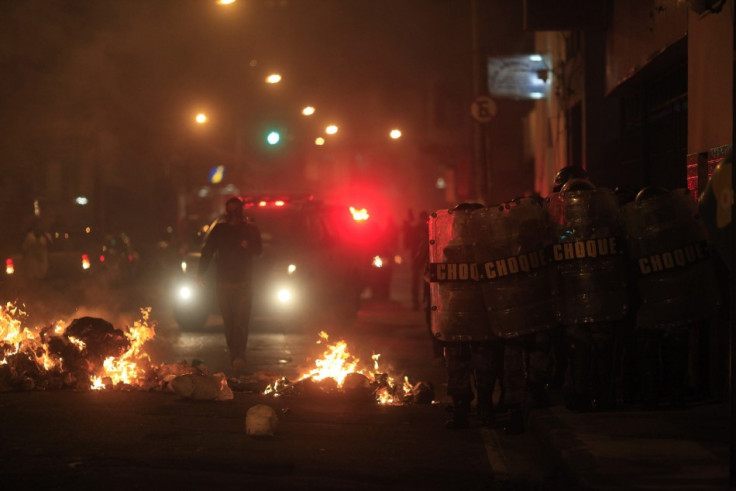 Police in Rio battle protesters near the city's administrative centre.