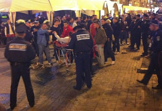 An injured English football fan lies on a stretcher and surrounded by medical personnel and police in central Kiev (Reuters) An injured English football fan lies on a stretcher and surrounded by medical personnel and police in central Kiev (Reuters)