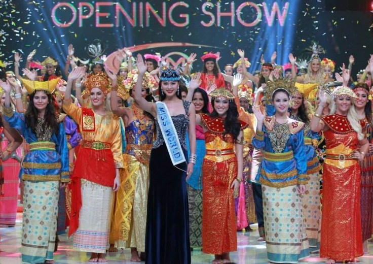Miss World 2013 contestants are seen in traditional Indonesian dresses as they pose with Miss World 2012 during the opening ceremony of the pageant in Bali, on 8 September. (Photo: Miss World/Facebook)