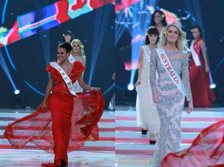 Miss World Aruba 2013 and Miss World Australia 2013 gesture as they catwalk during the opening ceremony of Miss World 2013 pageant. (Photo: Miss World/Facebook)