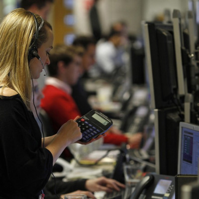 A trader works on the trading floor in London