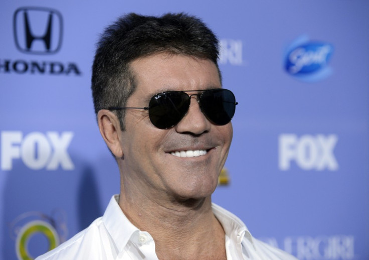 Simon Cowell has plenty to smile about after pocketing a fortune for X-Factor PIC: Reuters
