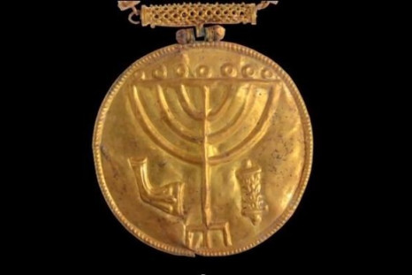 A 10-cm wide gold medallion discovered in Hebrew University excavations at the foot of the Temple Mount in Jerusalem. (Photo: Ouria Tadmor/The Hebrew University of Jerusalem)