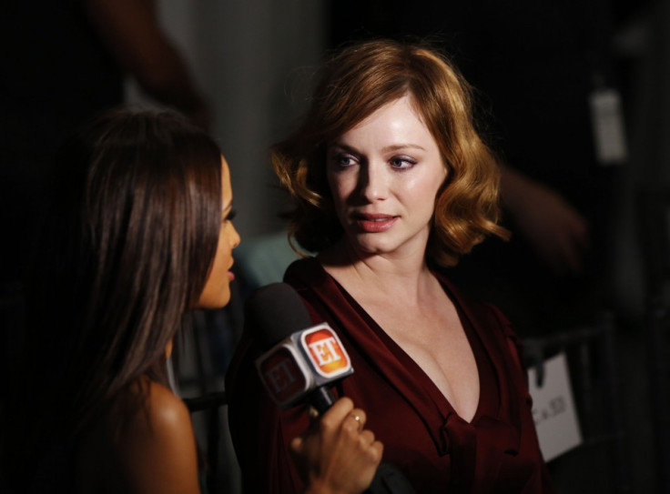 Actress Christina Hendricks talks to the media before the presentation of the Carolina Herrera Spring/Summer 2014 collection. (REUTERS/Lucas Jackson)