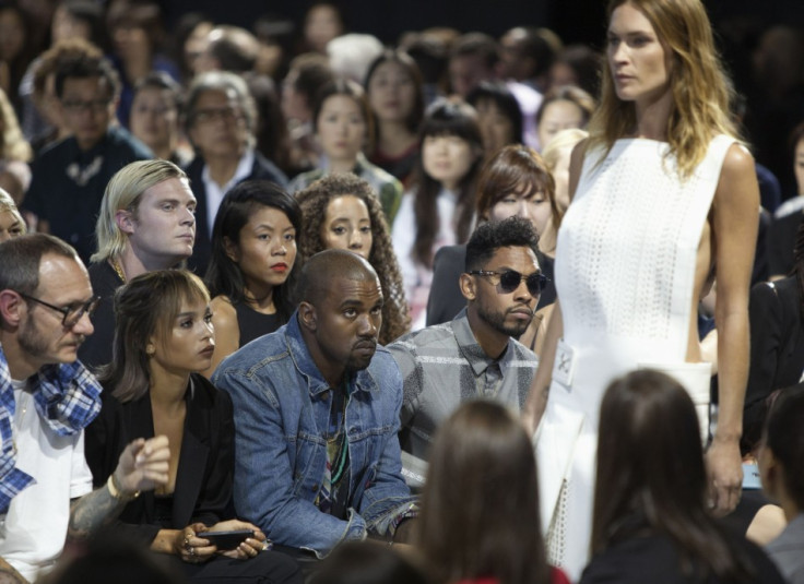 From L-R: Photographer Terry Richardson, an unidentified woman, rapper Kanye West and singer Miguel watch the Alexander Wang Spring/Summer 2014 collection. (REUTERS/Lucas Jackson)