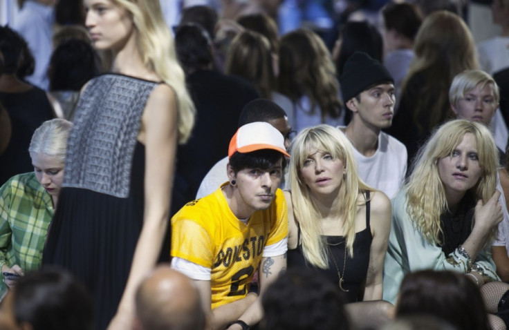 Singer Courtney Love watches the Alexander Wang Spring/Summer 2014 collection. (REUTERS/Lucas Jackson)