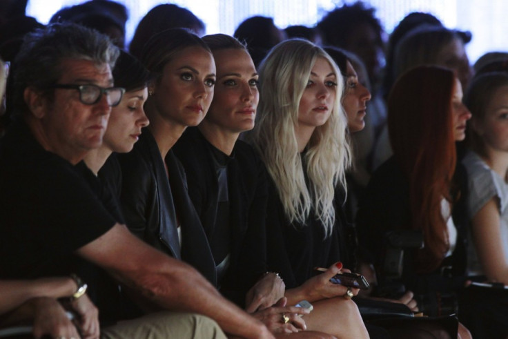 Stacy Keibler (3rd L) and actresses Molly Sims (C) and Taylor Momsen (5th L) watch a presentation of the Helmut Lang Spring/Summer 2014 collection. (REUTERS/Lucas Jackson)