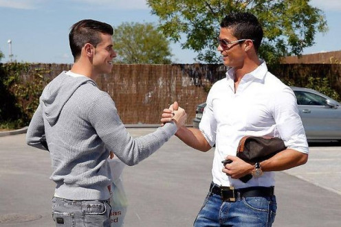 Gareth Bale and Christiano Ronaldo greet each other at Real Madrid car park PIC: Real Madrid