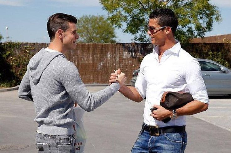 Gareth Bale and Christiano Ronaldo greet each other at Real Madrid car park PIC: Real Madrid