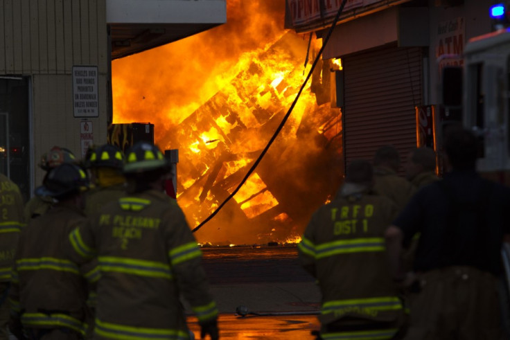 New Jersey firefighters work to control a massive fire in Seaside Park in New Jersey