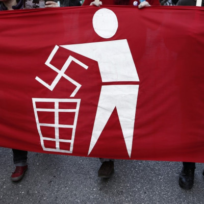 Banner held by ant-Nazi protesters at a rally in athens in February.