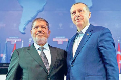 Recep Erdogan, right, with Mohamed Morsi