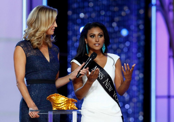 Miss New York Nina Davuluri (R) answers a question from host Lara Spencer during the 2014 Miss America Pageant. (REUTERS/Lucas Jackson)
