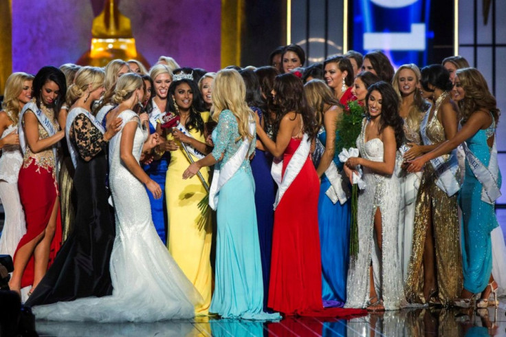Nina Davuluri (in yellow) celebrates with other contestants after being crowned Miss America 2014. (REUTERS/Lucas Jackson)