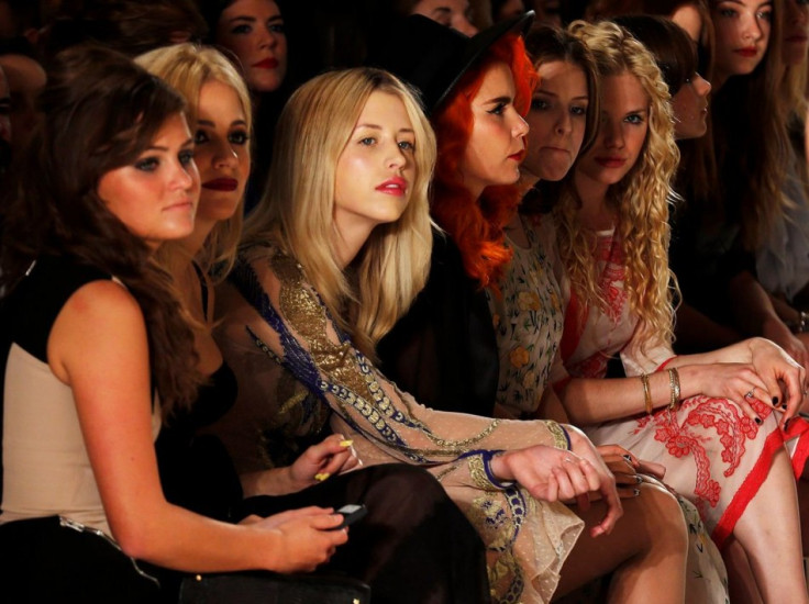 Singer Pixie Lott, Peaches Geldof, singer Paloma Faith, and actresses Anna Kendrick and MacKenzie Mauzy watch the presentation for the Temperley Spring/Summer 2014 collection. (REUTERS/Suzanne Plunkett)